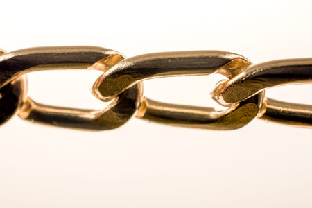 gold color metal chain on white background