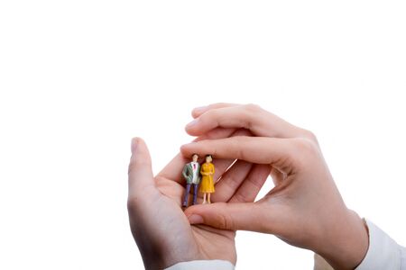 figurine model men in hand on a white backgroundの写真素材