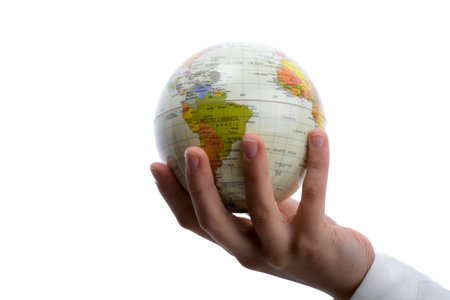 Child holding a small globe in hand on white background