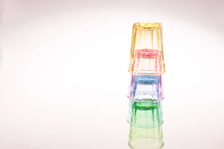 Colorful drinking glasses on white backgroundの写真素材
