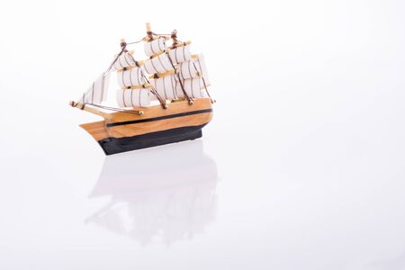Little model sailboat on a white backgroundの写真素材