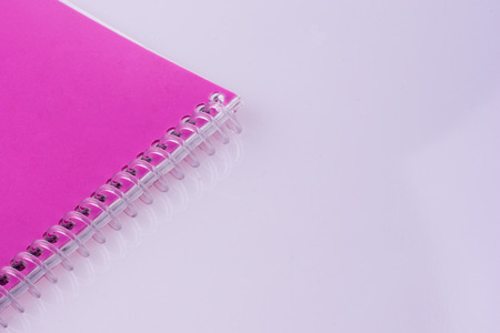 Purple Spiral Notebook on a white backgroundの写真素材