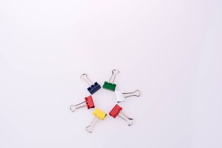 Colored paper clips on a white backgroundの写真素材
