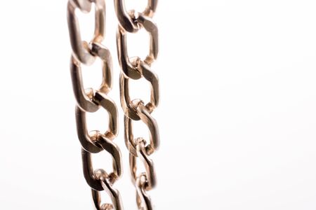 gold color metal chain on white backgroundの写真素材