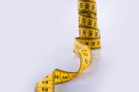 Measuring tape on a white backgroundの写真素材