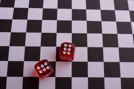 Red Dice  on a checked backgroundの写真素材
