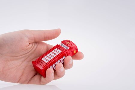 Telephone booth in handの写真素材