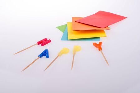colored envelopes and Color candles on sticks write happyの写真素材
