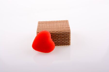 heart shape object and a gift box  on white backgroundの写真素材