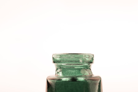 Little colorful empty  glass bottle on a white backgroundの写真素材