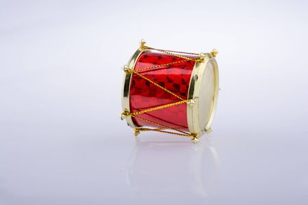 Little colorful toy drums  on a white backgroundの写真素材