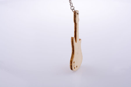 Mini wooden guitar model on a white background