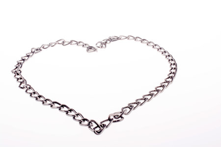 Chain form a heart shape and the word LOVE on grassの写真素材