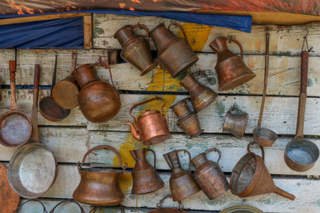 Ancient metal jugs in oriental style  in antique market