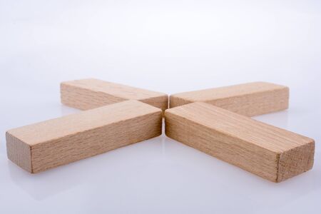 Wooden domino  pieces positioned on white backgroundの写真素材