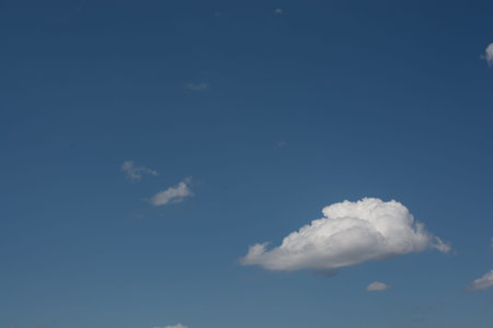 Blue cloudy sky with white  clouds