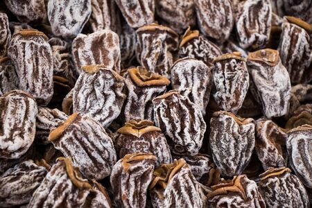 persimmon dry in the sun as a dry fruitの写真素材