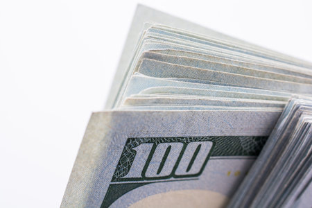 American 100 dollar  banknotes made of paper placed on white background