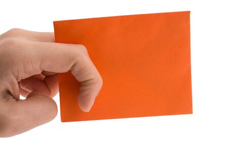 hand holding a red envelope on a white backgroundの写真素材