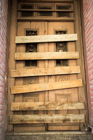 Old  styled wooden door of an old buildingの写真素材