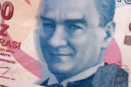 Hand holding Turksh Lira banknotes  on white backgroundの写真素材