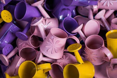 Set of colorful watering cans made of metalの写真素材