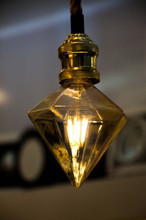 light bulbs are hanging on a fixed placeの写真素材