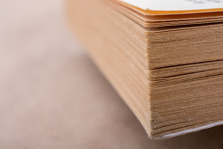 Book pages partly in view on white background