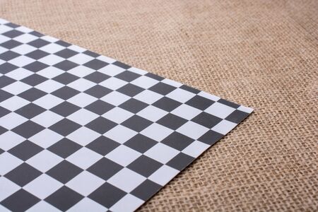 Piece of checked paper  on a linen canvasの写真素材