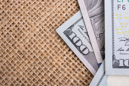 Banknote of US dollar placed on a linen canvasの写真素材