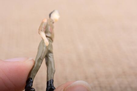 Man  figurine on a brown backgorundの写真素材