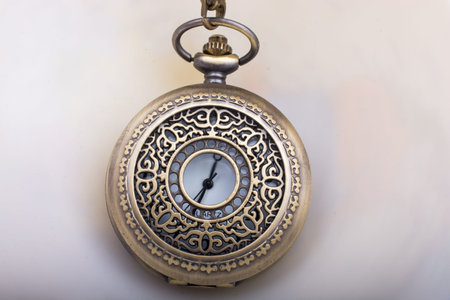 Retro style pocket watch on white background