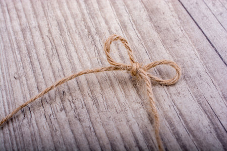 Thread tied  as knot on a light color background