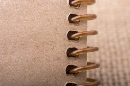brown color notebook placed on a canvas backgroundの写真素材