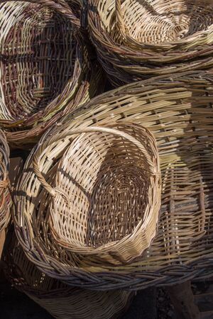 Empty wicker baskets are for sale in a market placeの写真素材