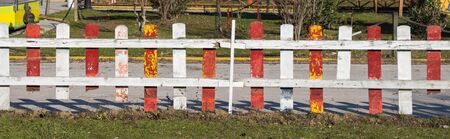 Close up of a part of decorative colorful wooden fenceの写真素材
