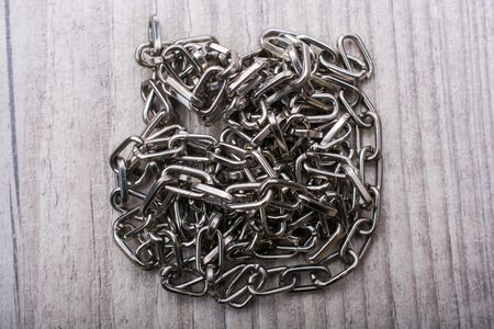 chain made of silver color metal on grey backgroundの写真素材