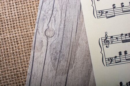 Musical notes  on paper placed on a linen canvasの写真素材