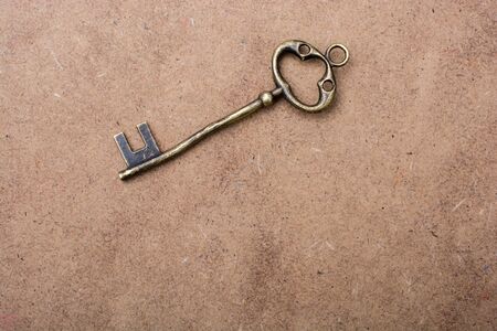 Retro styled golden color key forms the word keyの写真素材