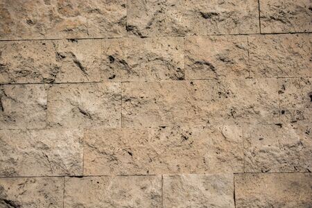 Wall made of the same type and same color of stonesの写真素材