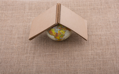 Globe is placed on canvas backgroundの写真素材