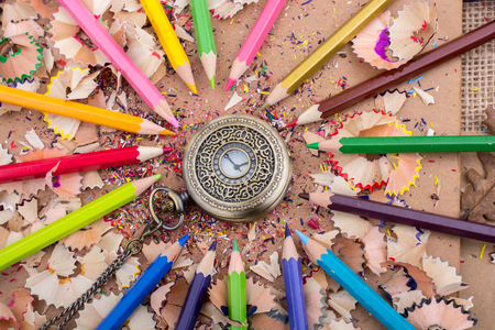 Mechanical pocket watch on pencil and shavingsの写真素材