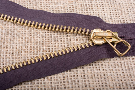 Closeup of a colorful  zipper on linen canvas