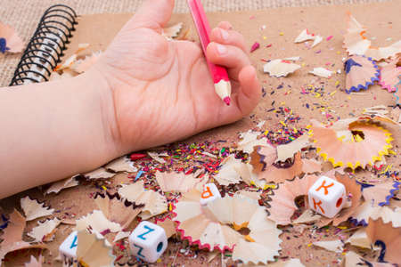 Red Color Pencil over  pencil shavingsの写真素材