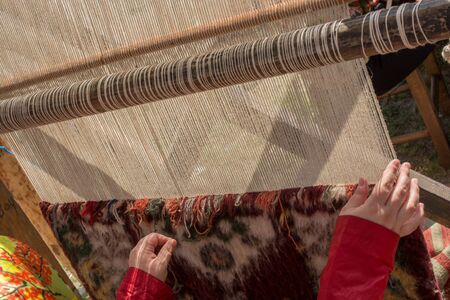 Part of loom with homemade thread on itの写真素材