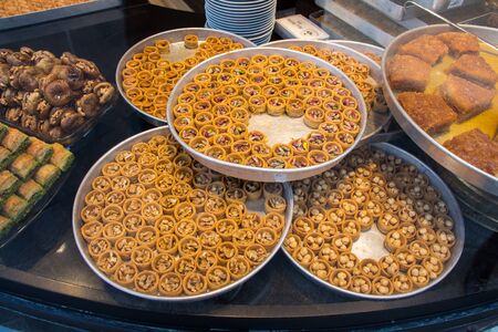 Nut stuffed dessert of mini size cuisine in handの写真素材