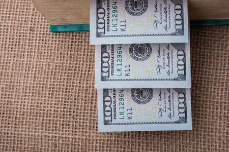 Banknotes of US dollars on canvas on a linen canvasの写真素材