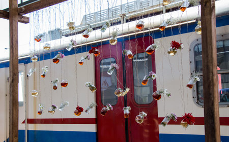 Herbal tea bottle with flowers hanging on string