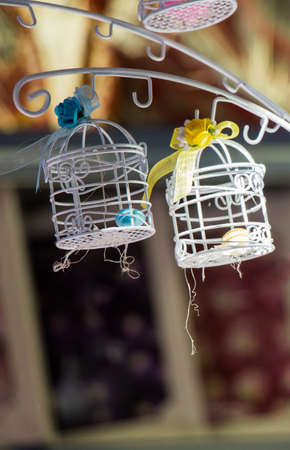 Little white bird houses made of metalの写真素材