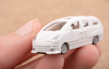 Toy car as a transportation devices in handの写真素材